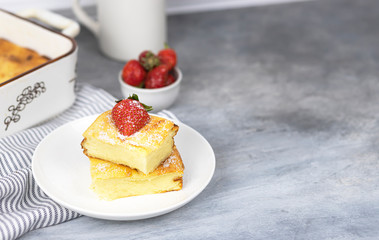 cottage cheese casserole with strawberries on a white plate