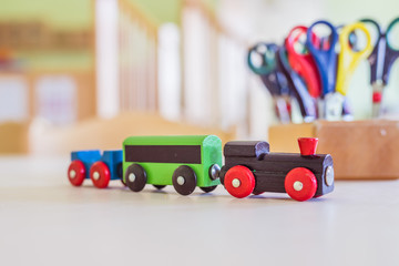Children development concept: Close up of wooden toy railroad in the kindergarten