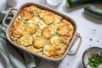 casserole with cheese and zucchini in baking dish