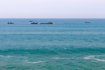 View of the ships in the Atlantic Ocean near Morocco in sunny day.