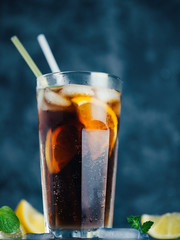 summer ice tea is a refreshing drink . iced tea, lemon and mint or alcoholic classic long island