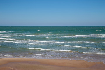 Fototapeta na wymiar Seashore in clear windy weather