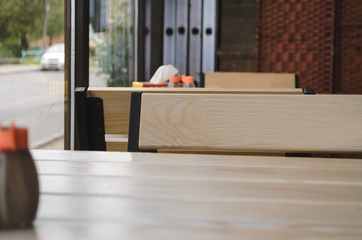 Stock photo for a cafe. Table and chairs in the cafe, view of the window. Space for writing on the table and chair