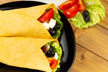 Vegetarian healthy corn tortillas vegetables wooden table. Selective focus