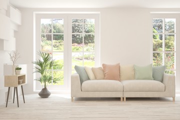 White living room with sofa and summer landscape in window. Scandinavian interior design. 3D illustration