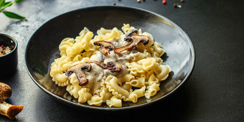 pasta creste di galla sauce with mushrooms and cream Menu concept healthy eating. food background top view copy space