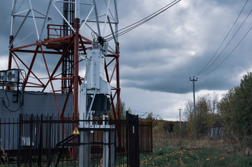 Cell phone antenna and communication tower - signal transmission with transformer box