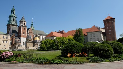 Fototapeta na wymiar Royal Wawel Castle and beautiful garden with colorful flowers. Cracow, Poland. 