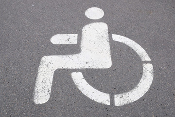 Parking sign for people with disabilities, disability concept, white sign of a person in a...