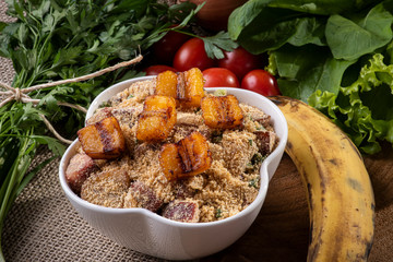Brazilian banana farofa. Made from manioc flour, bacon, banana and sausage.