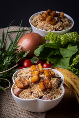 Brazilian banana farofa. Made from manioc flour, bacon, banana and sausage.