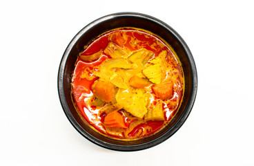 Massaman curry is a fusion of Thai and Indian style curries served in black bowl on white background.In 2011, Massaman curry was the 1st most delicious food in the World's 50 most delicious food.