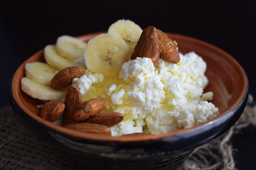 Fresh cottage cheese with fruit, nuts and honey.Healthy diet.