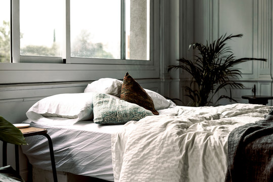 Unmade bed in a loft