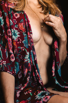 Close-up of a senior woman wearing a floral nightshirt