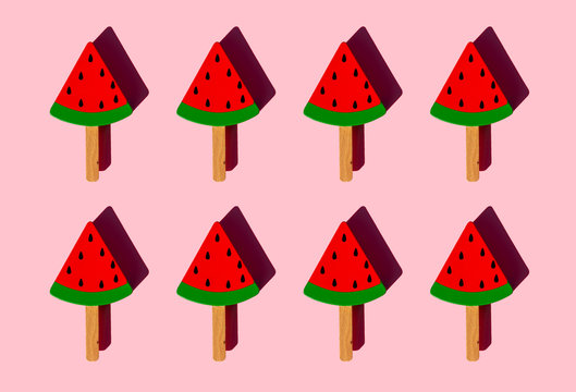 Rows of popsicle sticks with toy watermelon slices