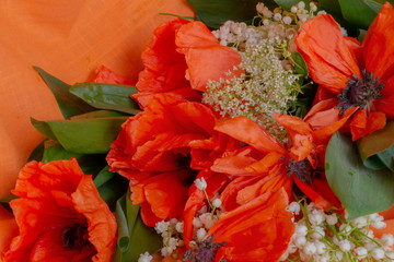 bouquet of orange poppies and lilies of the valley