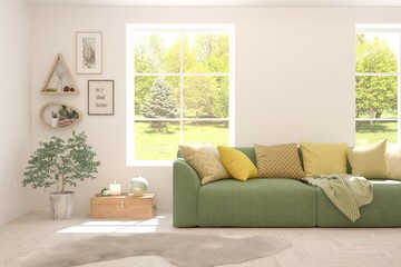 White living room with sofa and summer landscape in window. Scandinavian interior design. 3D illustration