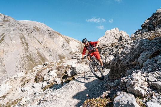 Man riding on mountainbike, Munestertal Valley, Grisons, Switzerland