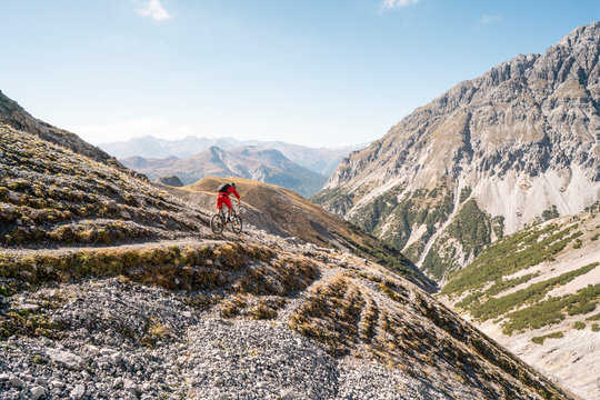 Man riding on mountainbike, Munestertal Valley, Grisons, Switzerland