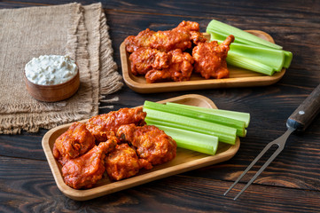 Buffalo wings with fresh celery stalks
