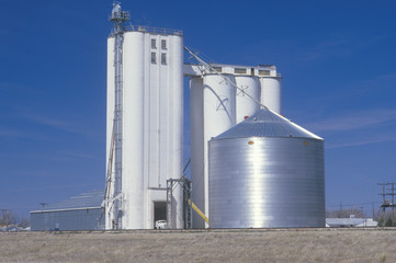 Grain silo co-op in KS with a blue sky in the background © spiritofamerica