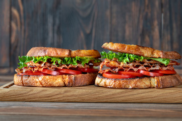 BLT sandwiches on the wooden board