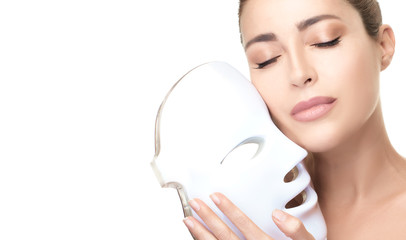 Beauty face woman with led mask. Anti aging photon therapy light treatment skin rejuvenation led...