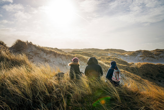 Denmark, Henne Strand, People hiking in dune landscape