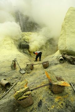 Indonesia, Java, Sulphur miners working in the crater at Kawah Ijen