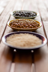 close up of a bowl of small brown beans