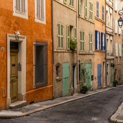 Fototapeta na wymiar A typical colorful street at Le Panier quarter, the picturesque historic center of Marseille, France