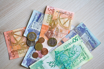 New banknotes and coins of the Belarusian ruble. The redenomination of the Belorusian ruble since July 1, 2016. Top view with copy space.