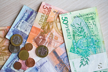 New banknotes and coins of the Belarusian ruble. The redenomination of the Belorusian ruble since July 1, 2016. Top view with copy space.