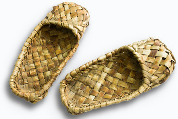 Bast shoes-traditional Russian peasant shoes close-up isolated on white background