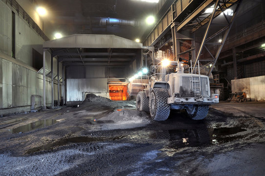 Germany, Steel mill, removal of slag with shovel excavator