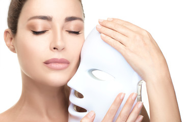 Healthy skin face woman. Skin rejuvenation led mask. Anti aging photon therapy light treatment