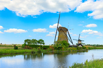 Old windmill on dutch landscape, Kinderdijk is a village in the municipality of Molenlanden, in the province of South Holland, Netherlands