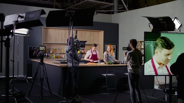 WIDE Behind the scenes of studio set, shooting TV television cooking show featuring celebrity chef, professional TV production. Shot on ARRI Alexa Mini