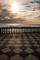 Sunset from Mascagni terrace in Livorno with stormy sea