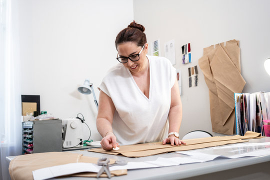 Seamstress working in tailor shop
