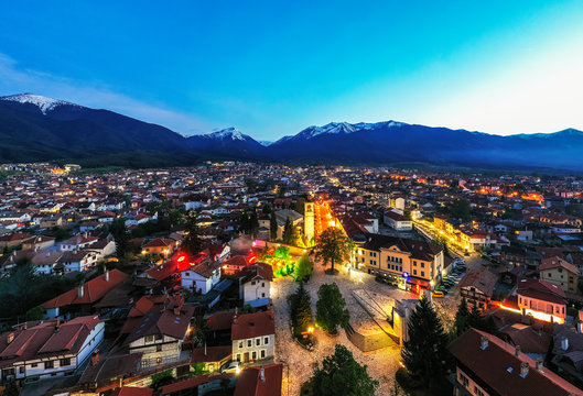 Aerial view by drone of Bansko old town and Pirin National Park, UNESCO World Heritage Site, Bankso, Bulgaria, Europe
