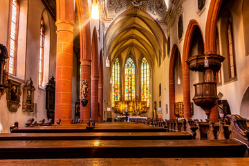 Fototapeta na wymiar Limburg, Germany - 21st May 2020: A german photographer visiting the city, taking pictures of the interior of the town church.