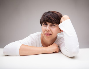 Puzzled or anxious woman deep in thought
