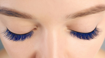 Young woman with beautiful blue eyelashes, closeup