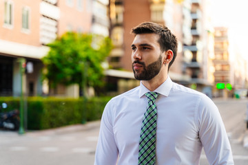 Young business man with white shirt and tie in outdoor city