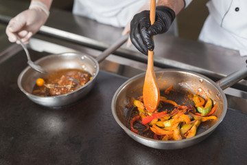 team of cooks cooks in a restaurant.