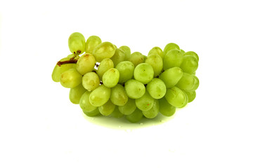 Bunch of grapes and raisins on a white background. Wine grapes, table grapes. Fresh fruit.