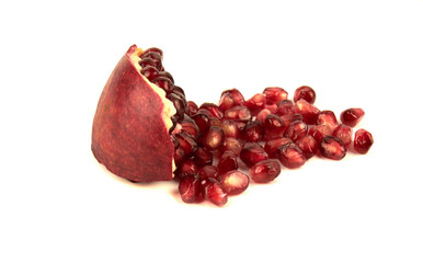 Juicy pomegranate fruit seeds Isolated on a white background. Seeds and sliced pomegranate