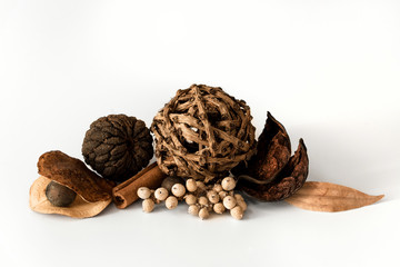 Nature object (canela, ball of larch branch, cinnamon stick, lily petals) for decoration isolated on a white background.